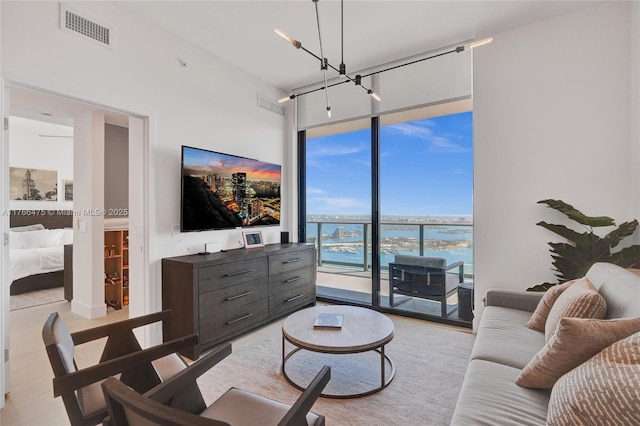601 NE 1st Ave Unit 5115, Miami, FL 33132 - living area featuring a wall of windows and a high ceiling