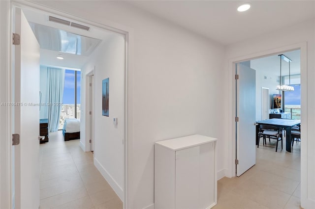 601 NE 1st Ave Unit 5115, Miami, FL 33132 - corridor featuring baseboards, a chandelier, and light tile patterned flooring