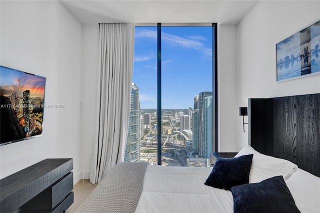 601 NE 1st Ave Unit 5115, Miami, FL 33132 - bedroom with floor to ceiling windows, a view of city, and tile patterned flooring