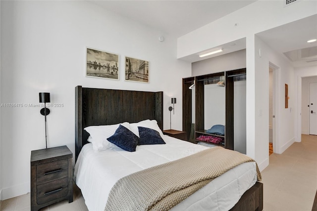 601 NE 1st Ave Unit 5115, Miami, FL 33132 - bedroom with baseboards and light tile patterned floors
