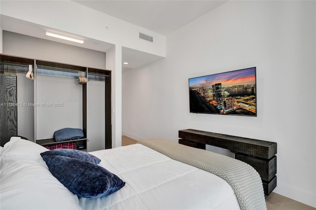601 NE 1st Ave Unit 5115, Miami, FL 33132 - bedroom with baseboards and tile patterned flooring