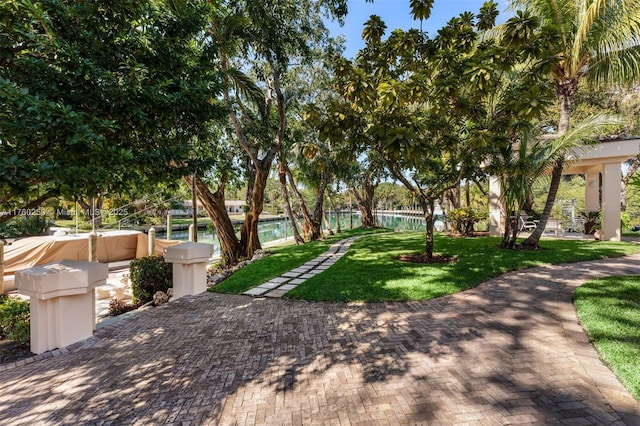 665 Leucadendra Dr, Coral Gables, FL 33156 - view of property's community with a lawn, fence, and a patio area