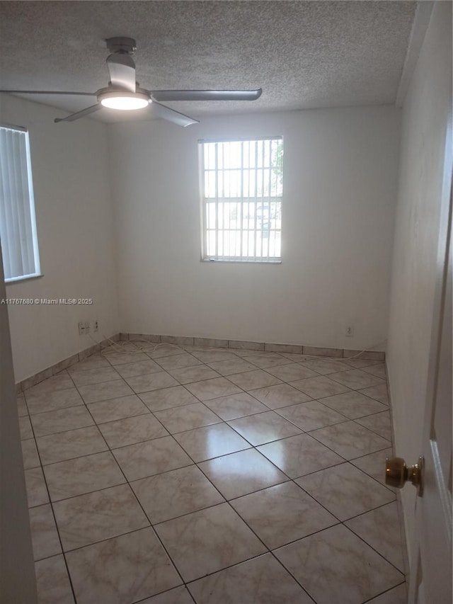 6464 Johnson St, Hollywood, FL 33024 - unfurnished room featuring light tile patterned floors, a textured ceiling, and ceiling fan