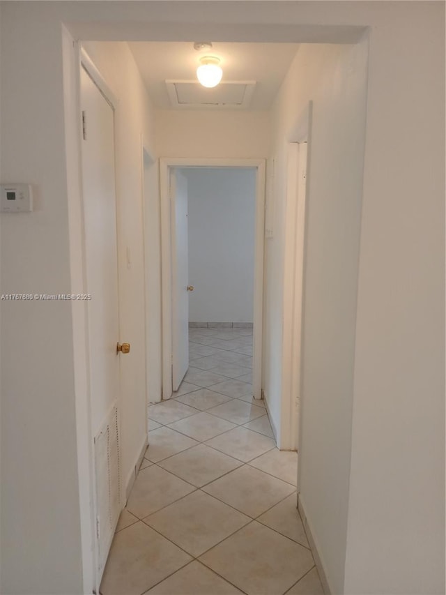 6464 Johnson St, Hollywood, FL 33024 - hall with visible vents, light tile patterned floors, and attic access