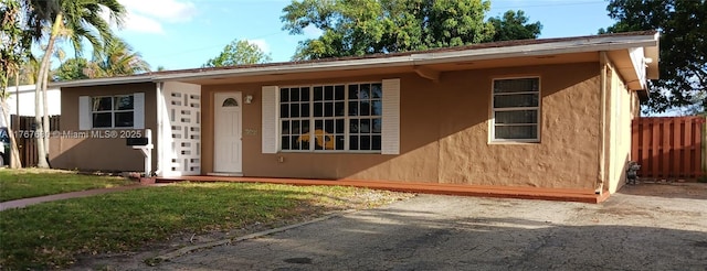 6464 Johnson St, Hollywood, FL 33024 - view of front of home featuring stucco siding and fence