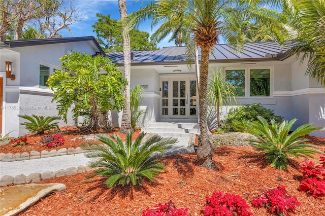 8951 SW 160th St, Palmetto Bay, FL 33157 - doorway to property featuring a standing seam roof, stucco siding, french doors, and metal roof