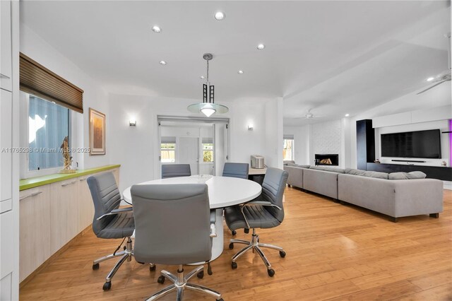 8951 SW 160th St, Palmetto Bay, FL 33157 - dining area with recessed lighting, light wood-style floors, and a fireplace