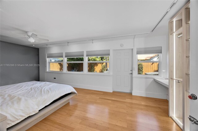 8951 SW 160th St, Palmetto Bay, FL 33157 - bedroom featuring wood finished floors, baseboards, and ceiling fan