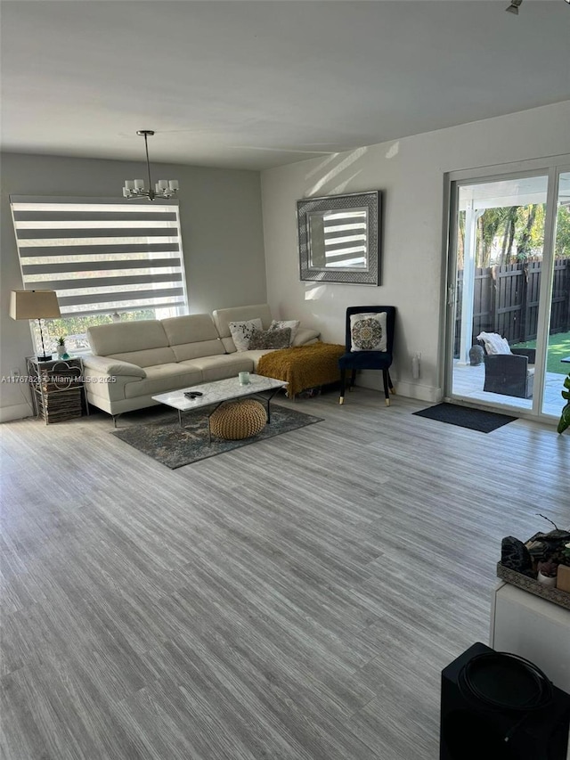 living area with an inviting chandelier