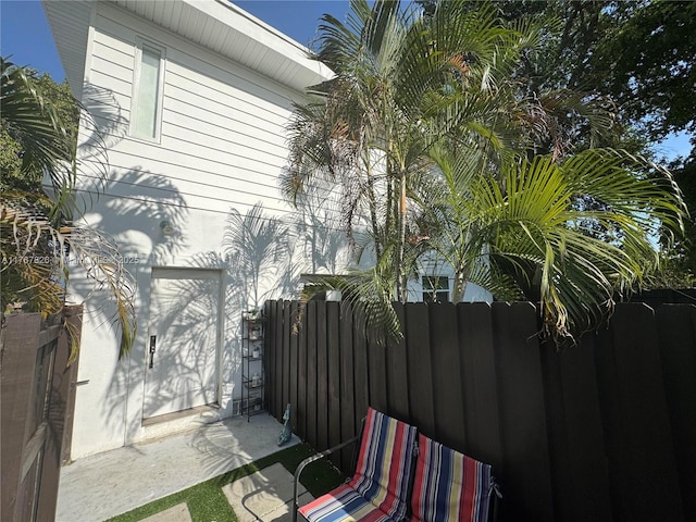 view of property exterior with fence