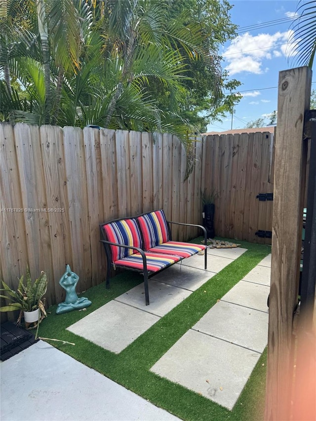 view of patio featuring fence