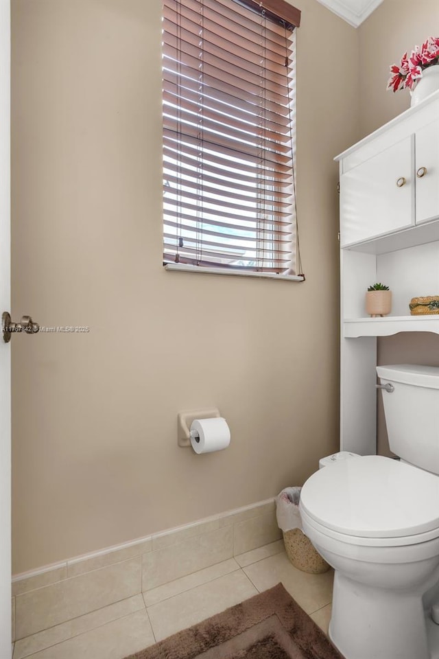 bathroom featuring tile patterned flooring and toilet
