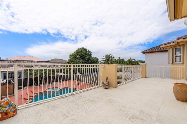 view of patio / terrace with a fenced in pool and fence