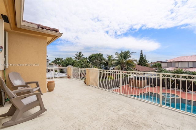view of patio / terrace featuring an in ground hot tub