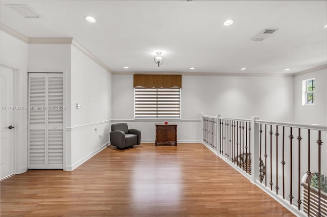 sitting room featuring recessed lighting, visible vents, baseboards, and wood finished floors