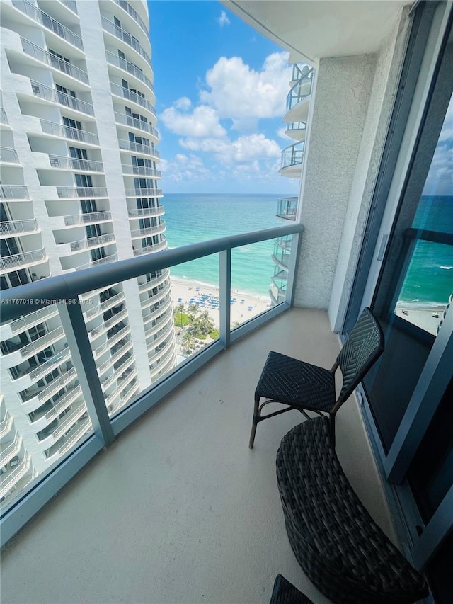 balcony featuring a water view
