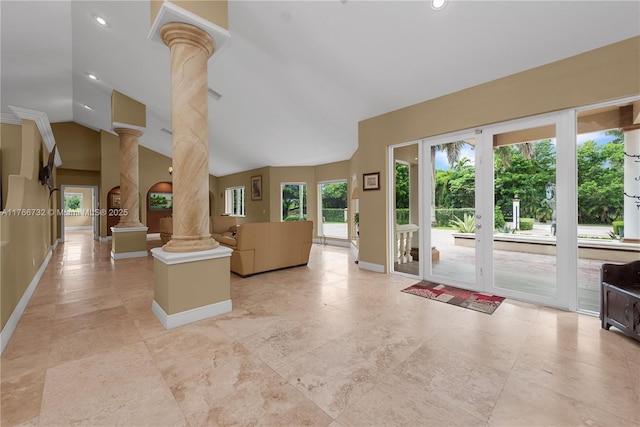 interior space with high vaulted ceiling, recessed lighting, baseboards, and ornate columns