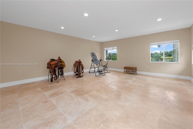exercise area featuring recessed lighting and baseboards