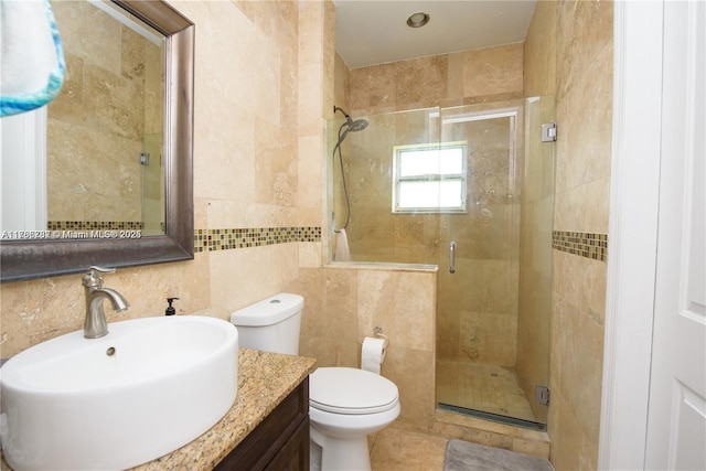 bathroom with toilet, tasteful backsplash, tile walls, a shower stall, and vanity