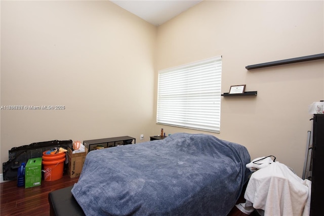 bedroom featuring wood finished floors