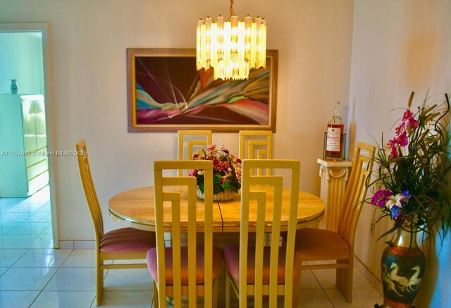 2910 Point E Dr Unit M414, Aventura, FL 33160 - dining space featuring a chandelier, tile patterned flooring, and baseboards