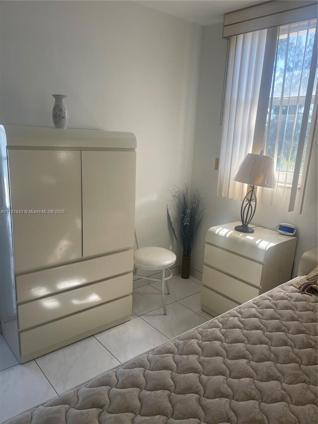 bedroom featuring light tile patterned floors