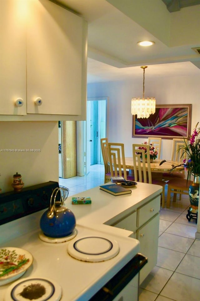 2910 Point E Dr Unit M414, Aventura, FL 33160 - kitchen with a chandelier, light tile patterned floors, light countertops, hanging light fixtures, and recessed lighting