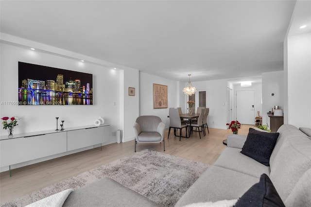 1904 S Ocean Dr Unit 801, Hallandale Beach, FL 33009 - living area with a notable chandelier and light wood-type flooring