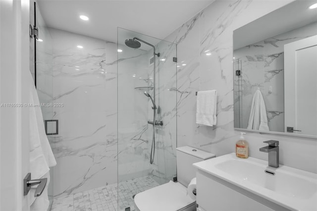 1904 S Ocean Dr Unit 801, Hallandale Beach, FL 33009 - bathroom with a marble finish shower, tile walls, toilet, recessed lighting, and vanity