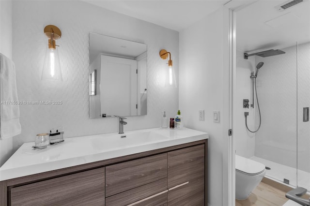 1904 S Ocean Dr Unit 801, Hallandale Beach, FL 33009 - full bathroom with visible vents, a shower stall, toilet, and vanity