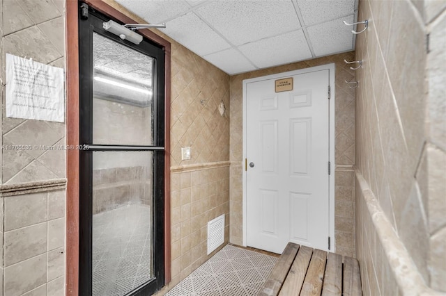 1904 S Ocean Dr Unit 801, Hallandale Beach, FL 33009 - bathroom with tile walls, a paneled ceiling, and visible vents