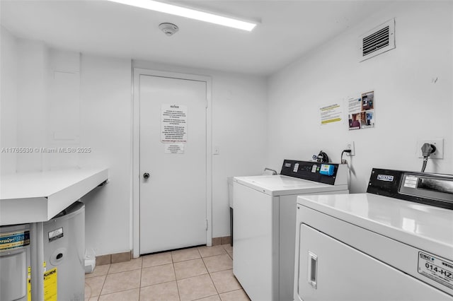 1904 S Ocean Dr Unit 801, Hallandale Beach, FL 33009 - community laundry room featuring washer and dryer, light tile patterned flooring, and visible vents
