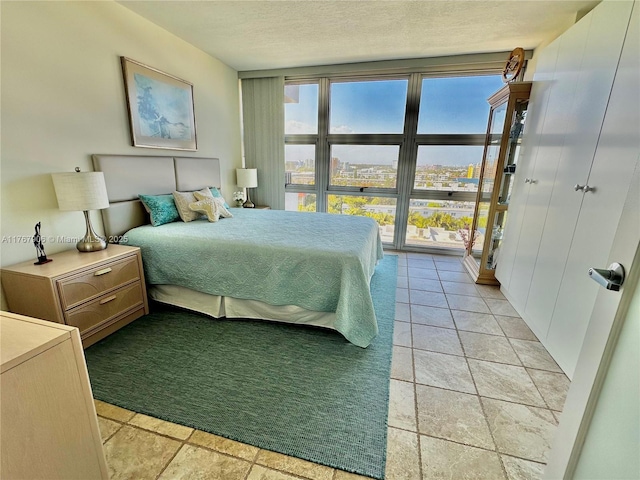 531 N Ocean Blvd Unit 1003, Pompano Beach, FL 33062 - bedroom featuring a textured ceiling