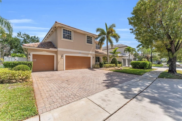 16831 SW 6th St, Pembroke Pines, FL 33027 - view of front of home with stucco siding, decorative driveway, an attached garage, and a tiled roof