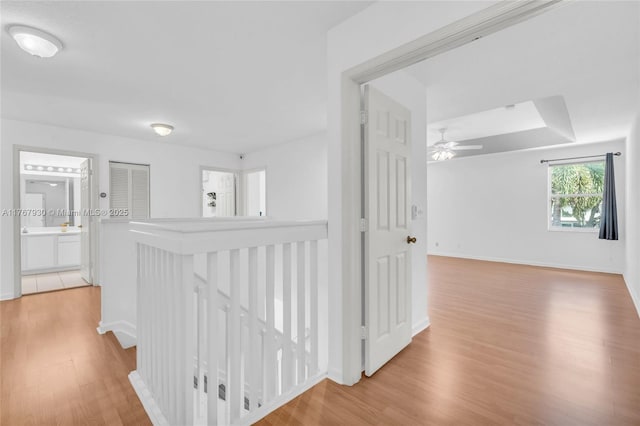 16831 SW 6th St, Pembroke Pines, FL 33027 - corridor with light wood-type flooring, an upstairs landing, and baseboards