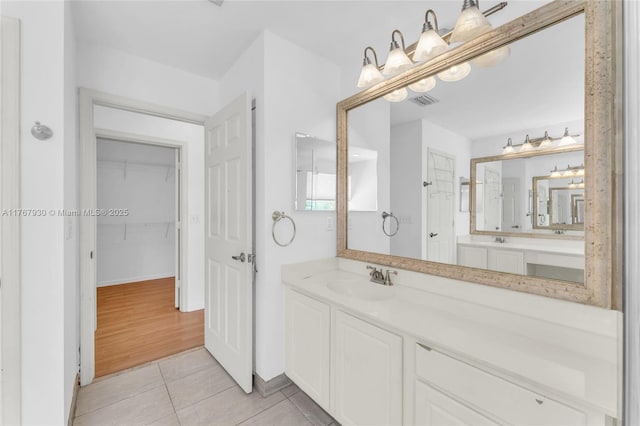 16831 SW 6th St, Pembroke Pines, FL 33027 - bathroom featuring a spacious closet, tile patterned flooring, vanity, and a shower