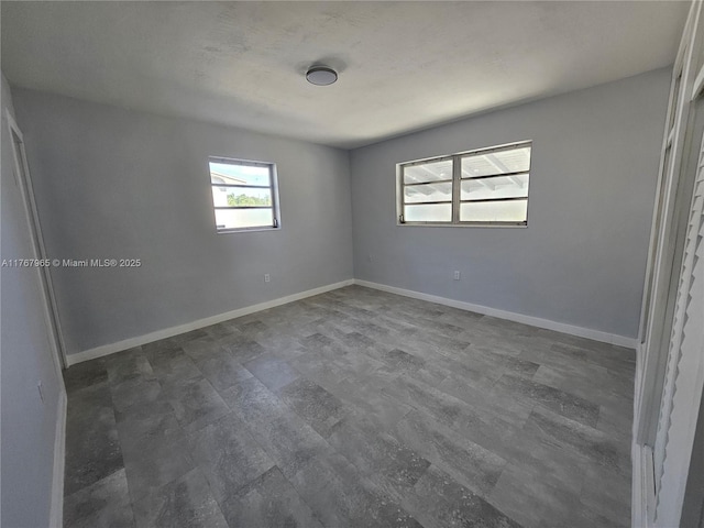 unfurnished bedroom with baseboards