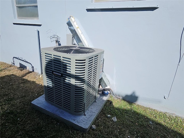 details with central air condition unit and stucco siding