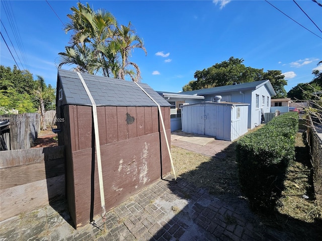 view of shed with a fenced backyard