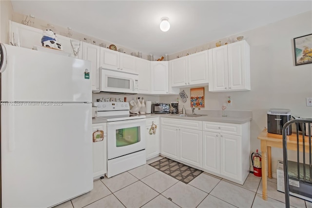 265 NE 12th Ave Unit 265, Homestead, FL 33030 - kitchen featuring a sink, white cabinetry, white appliances, light countertops, and light tile patterned floors