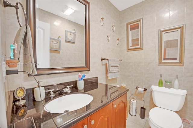 265 NE 12th Ave Unit 265, Homestead, FL 33030 - bathroom featuring tile patterned floors, vanity, tile walls, backsplash, and toilet