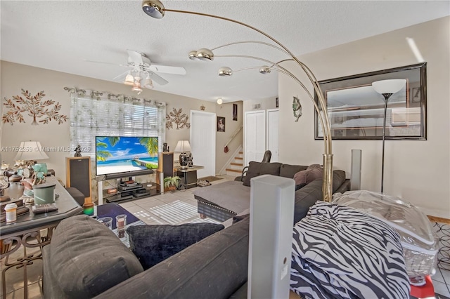 265 NE 12th Ave Unit 265, Homestead, FL 33030 - tiled living room with stairway, a textured ceiling, and ceiling fan