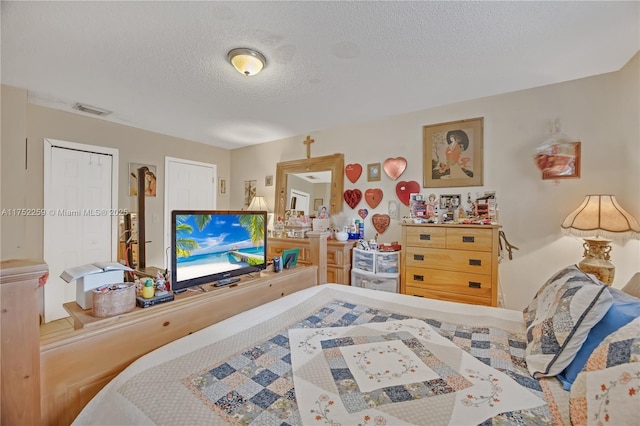 265 NE 12th Ave Unit 265, Homestead, FL 33030 - bedroom with visible vents and a textured ceiling