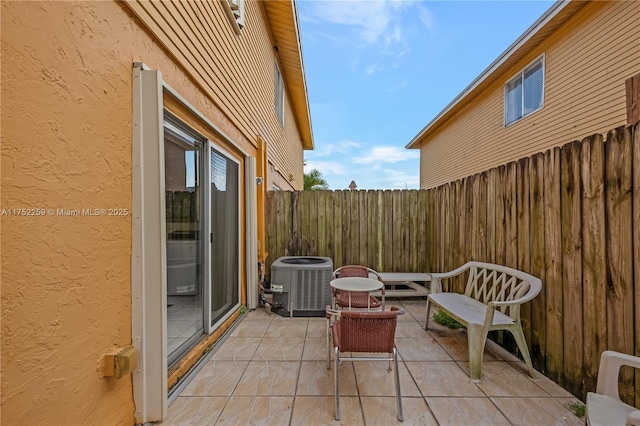 265 NE 12th Ave Unit 265, Homestead, FL 33030 - view of patio with a fenced backyard and central AC unit