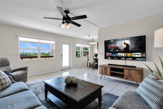 4032 Farnham O Unit 4032, Deerfield Beach, FL 33442 - living room with light tile patterned floors, a chandelier, a ceiling fan, and baseboards