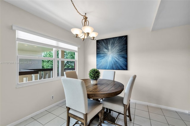 4032 Farnham O Unit 4032, Deerfield Beach, FL 33442 - dining area featuring a chandelier, baseboards, and light tile patterned floors