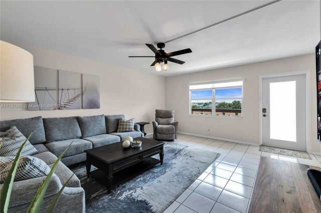 4032 Farnham O Unit 4032, Deerfield Beach, FL 33442 - living room featuring light tile patterned floors, a ceiling fan, and baseboards