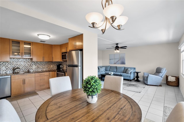 4032 Farnham O Unit 4032, Deerfield Beach, FL 33442 - dining room featuring light tile patterned floors, a ceiling fan, and a chandelier