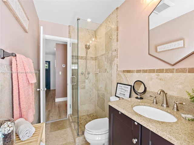 2190 NE 59th Ct, Fort Lauderdale, FL 33308 - full bath with tile walls, a shower stall, toilet, and vanity