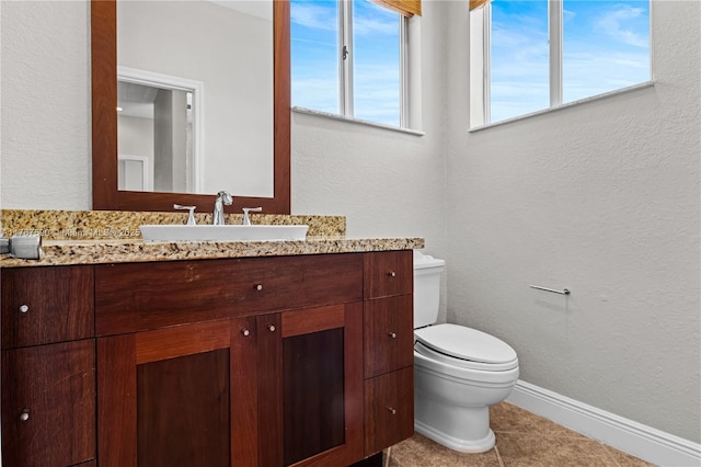 2080 SW 152nd Pl, Miami, FL 33185 - half bathroom featuring toilet, a textured wall, tile patterned flooring, and vanity